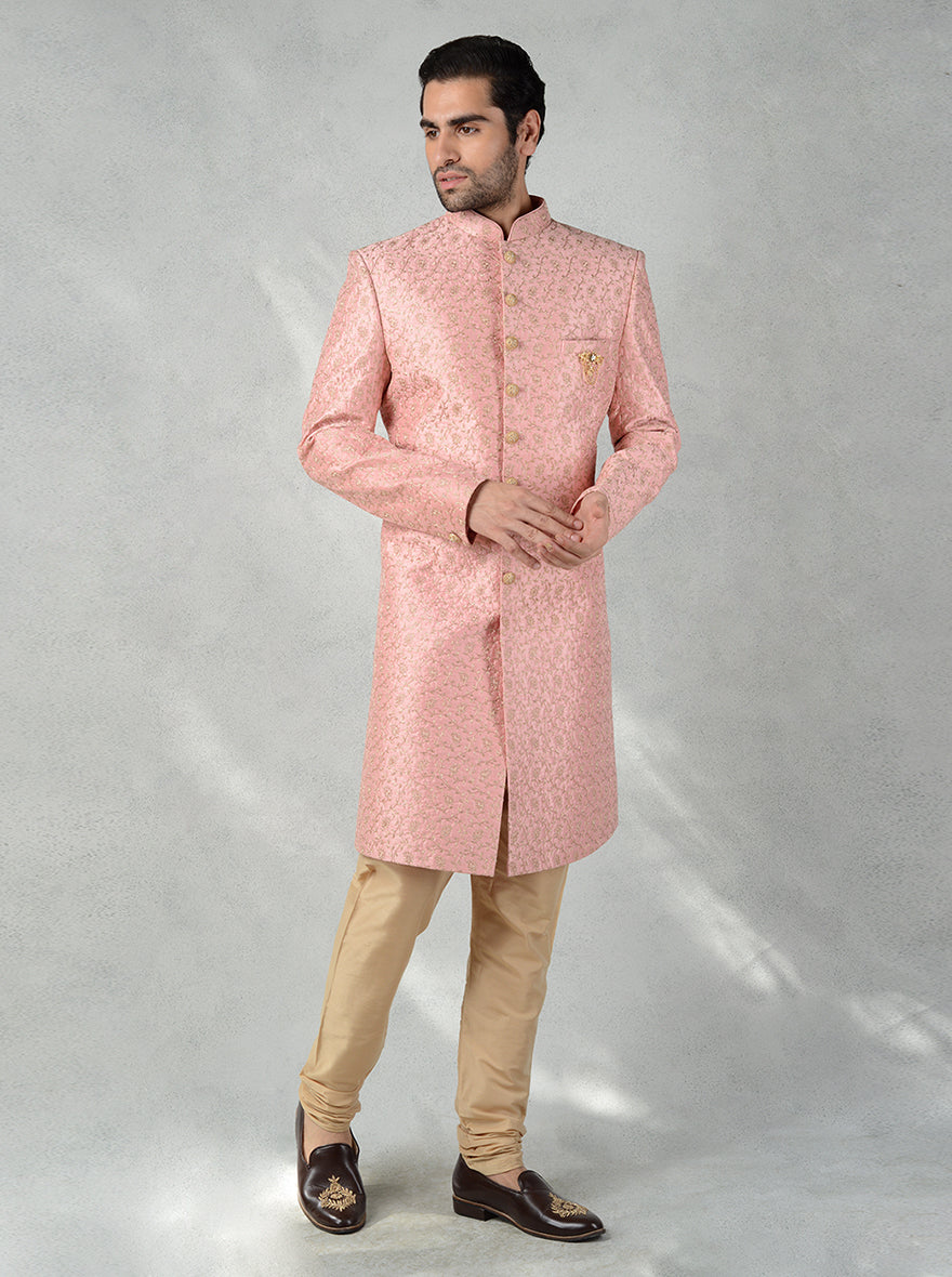 Traditional pink Indo-Western for men with straight cut, mandarin collar, and gold detailing.