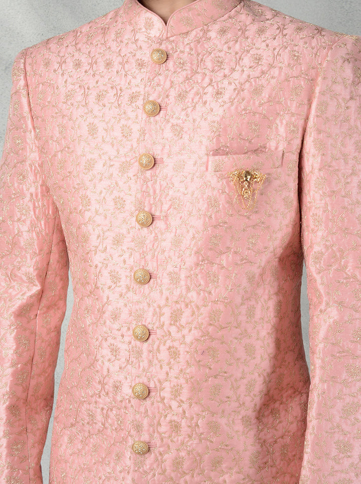 Groom's pink Indo-Western dress with gold embroidery, mandarin collar, and silk blend fabric.