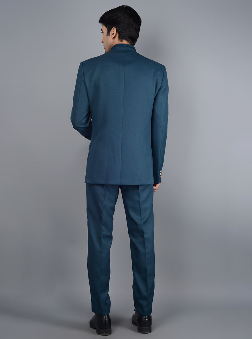 Groom's father wedding attire in solid teal blue.
