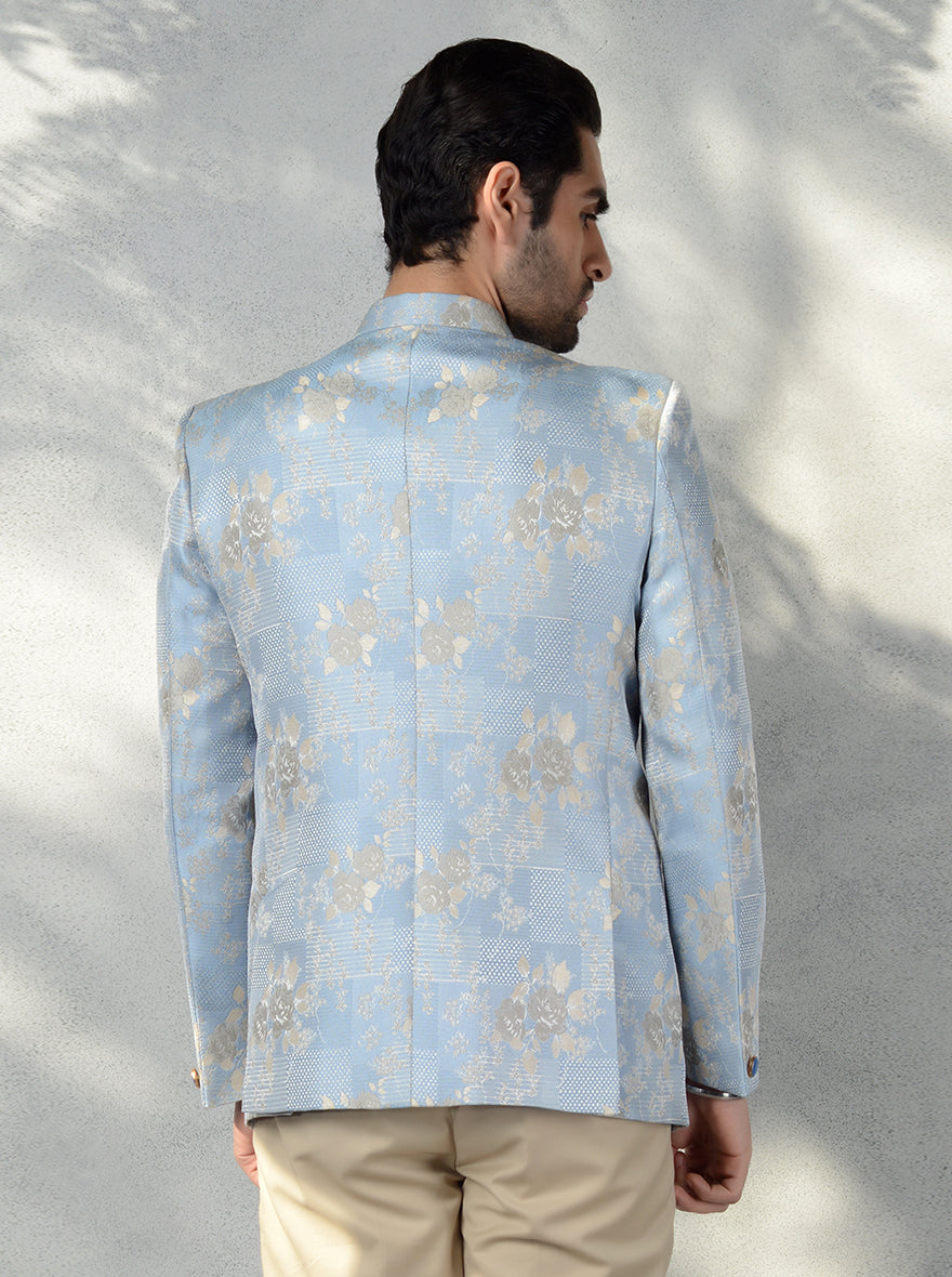 Full sleeve sky blue jodhpuri suit with golden brooch for weddings.