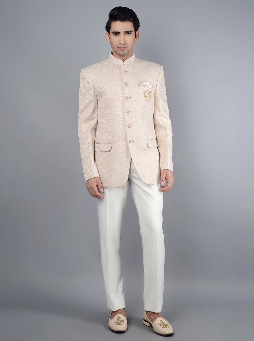 Elegant pink jodhpuri suit with self-designed pattern for formal occasions.
