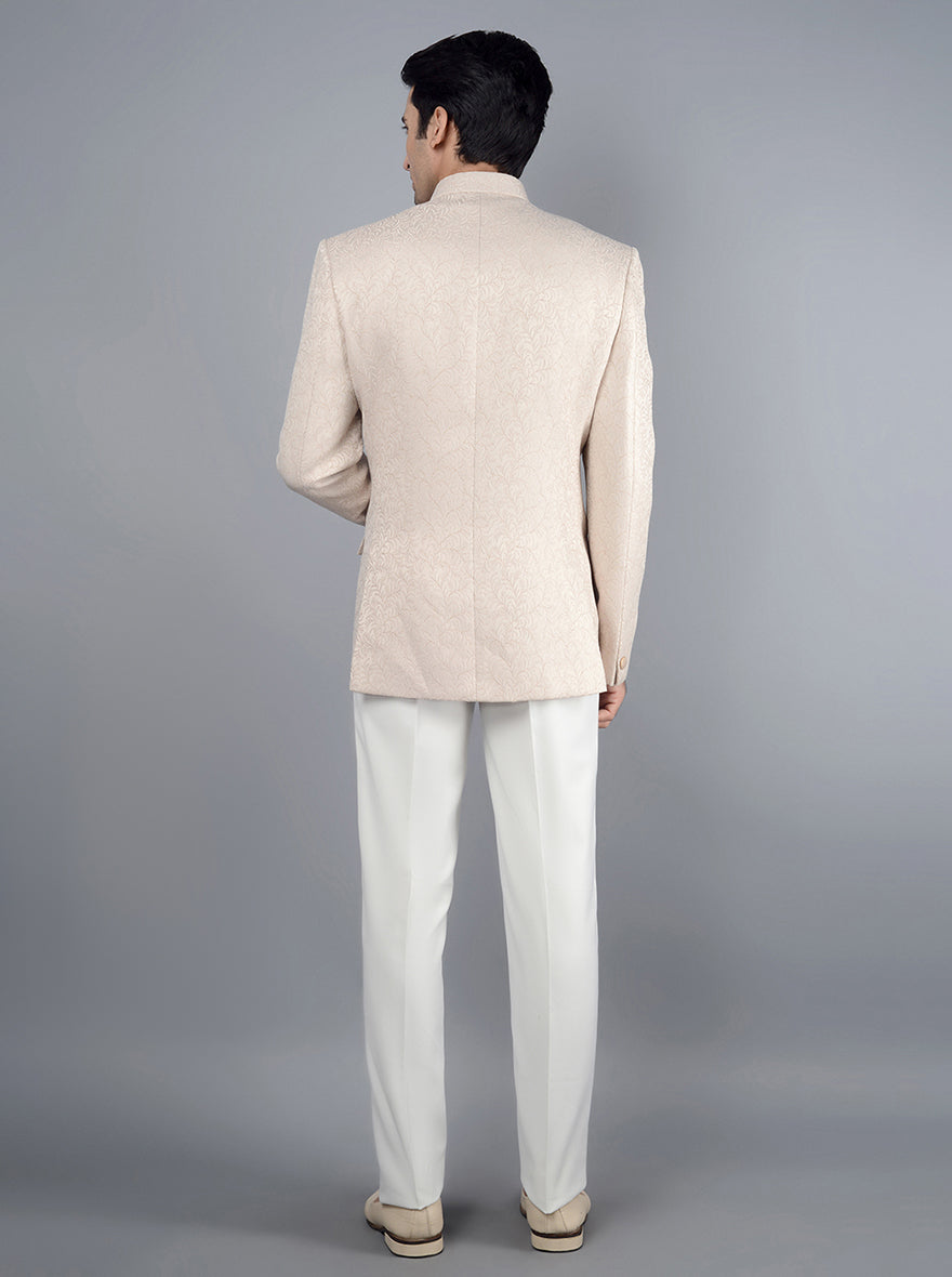 Men's pink jodhpuri suit with unique design and full sleeves.