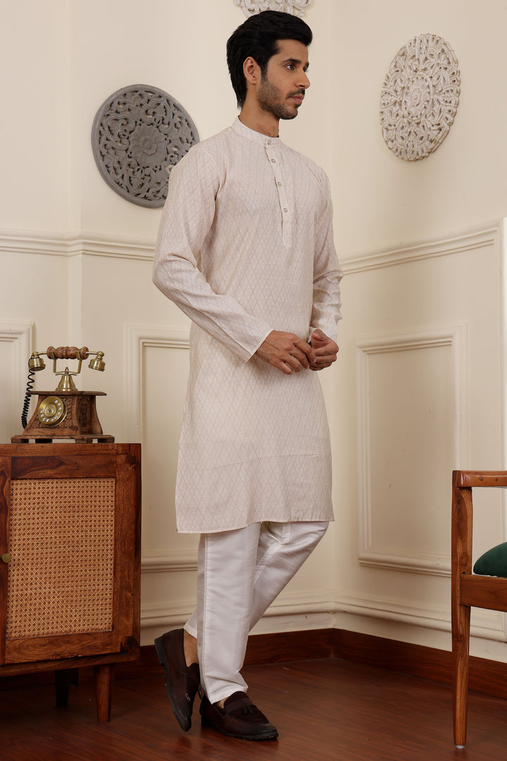 White embroidered kurta pajama set for men, ideal for celebrations
