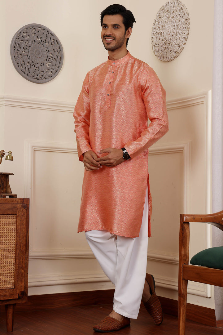 Elegant orange kurta for men, designed from Viscose fabric for comfort and style.