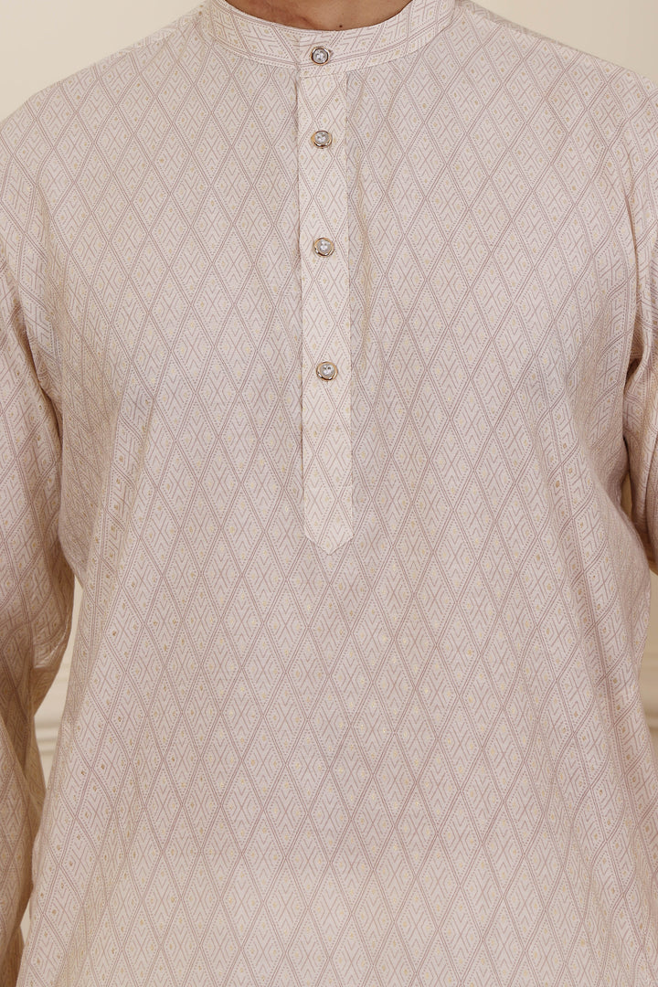Festive white kurta pajama for men with a sophisticated design
