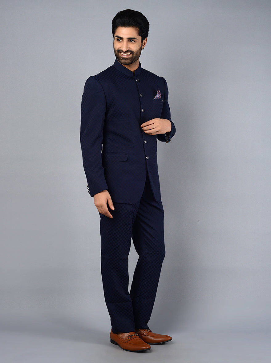 Blue jodhpuri suit with buttons and mandarin collar for wedding attire.