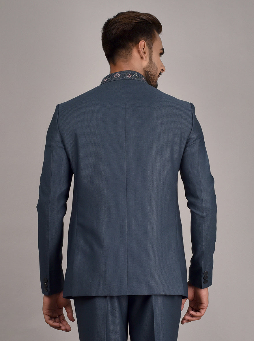 Stylish Blue Jodhpuri Suit with handwork embroidery and contrast pink thread.