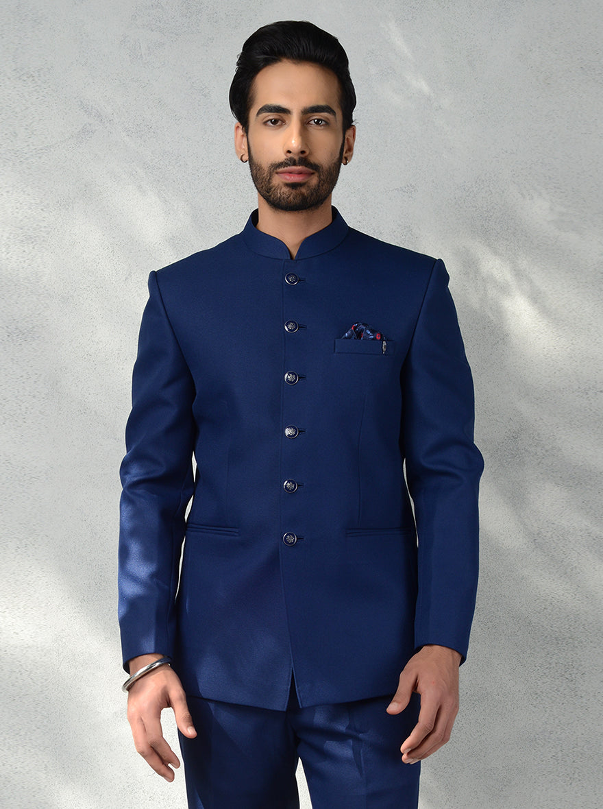 Royal Blue Jodhpuri Suit with metallic buttons and slim fit trousers for men’s wedding.